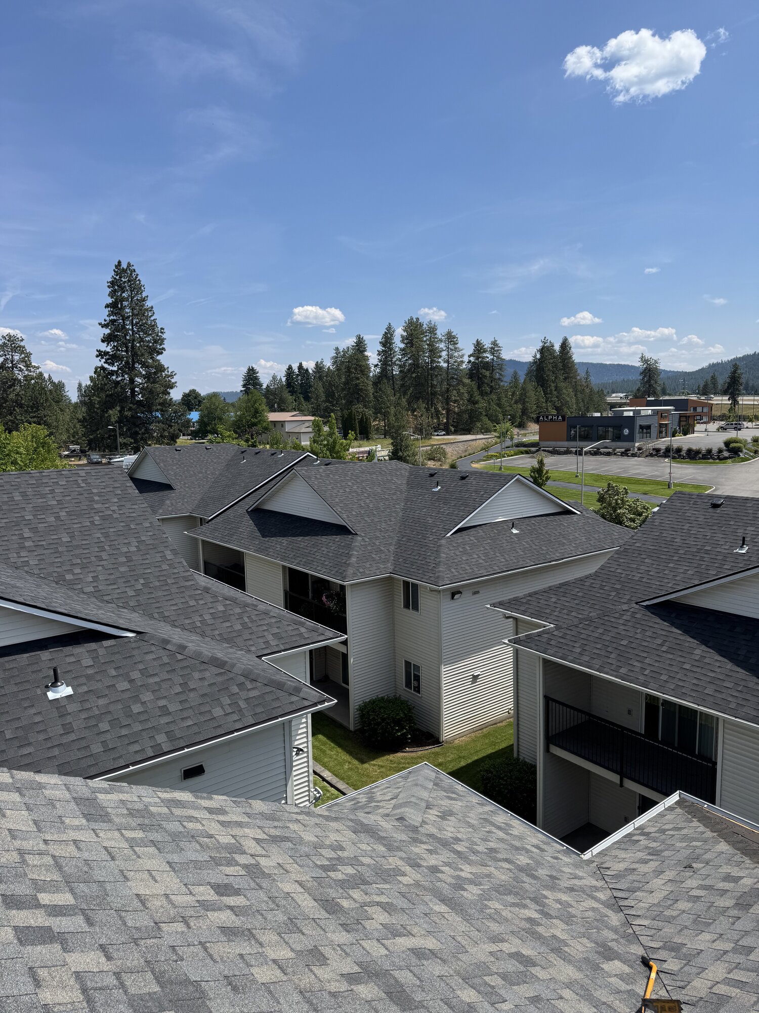 Aerial view of a multi-building commercial roofing project in North Idaho
