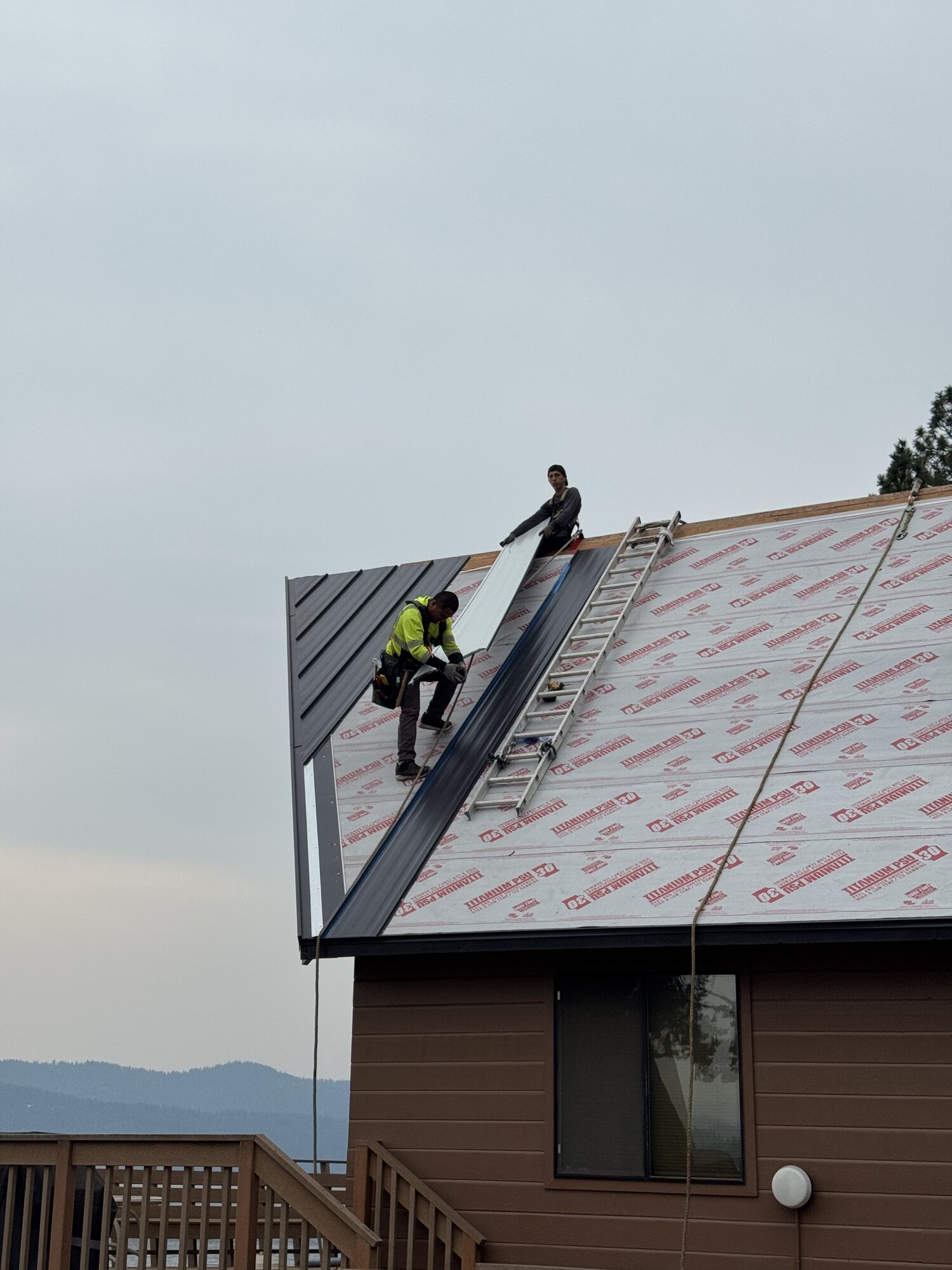 Standing seam metal roofing installation in North Idaho